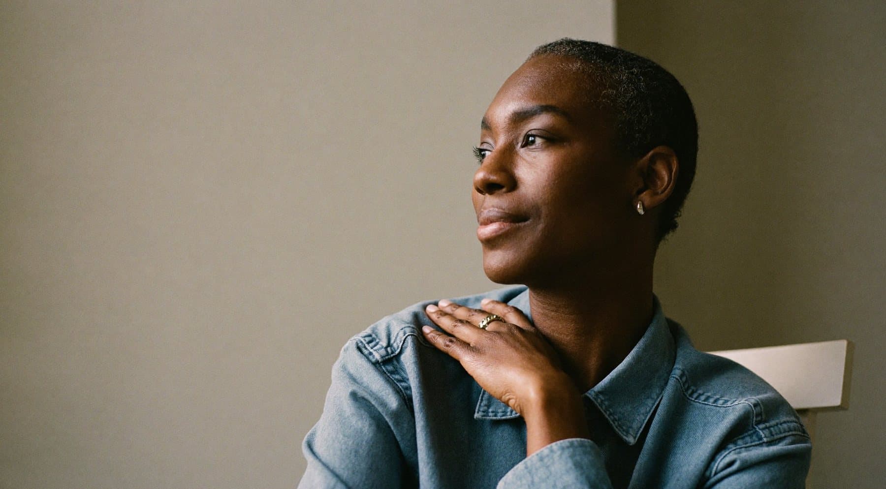 A woman in her fifties in soft natural light, calm and reassured
